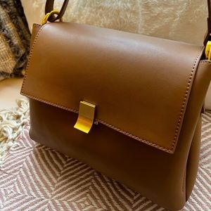 Slowline leather shoulder adjustable handbag